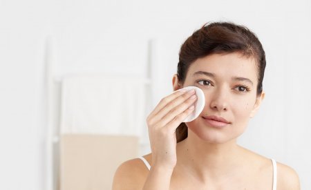 Bioderma - woman cleansing her face